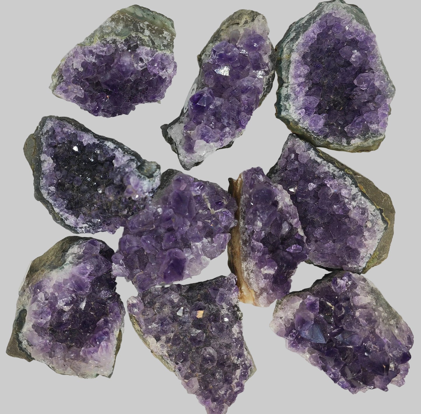 Amethyst geodes on a white background Earthstore UK