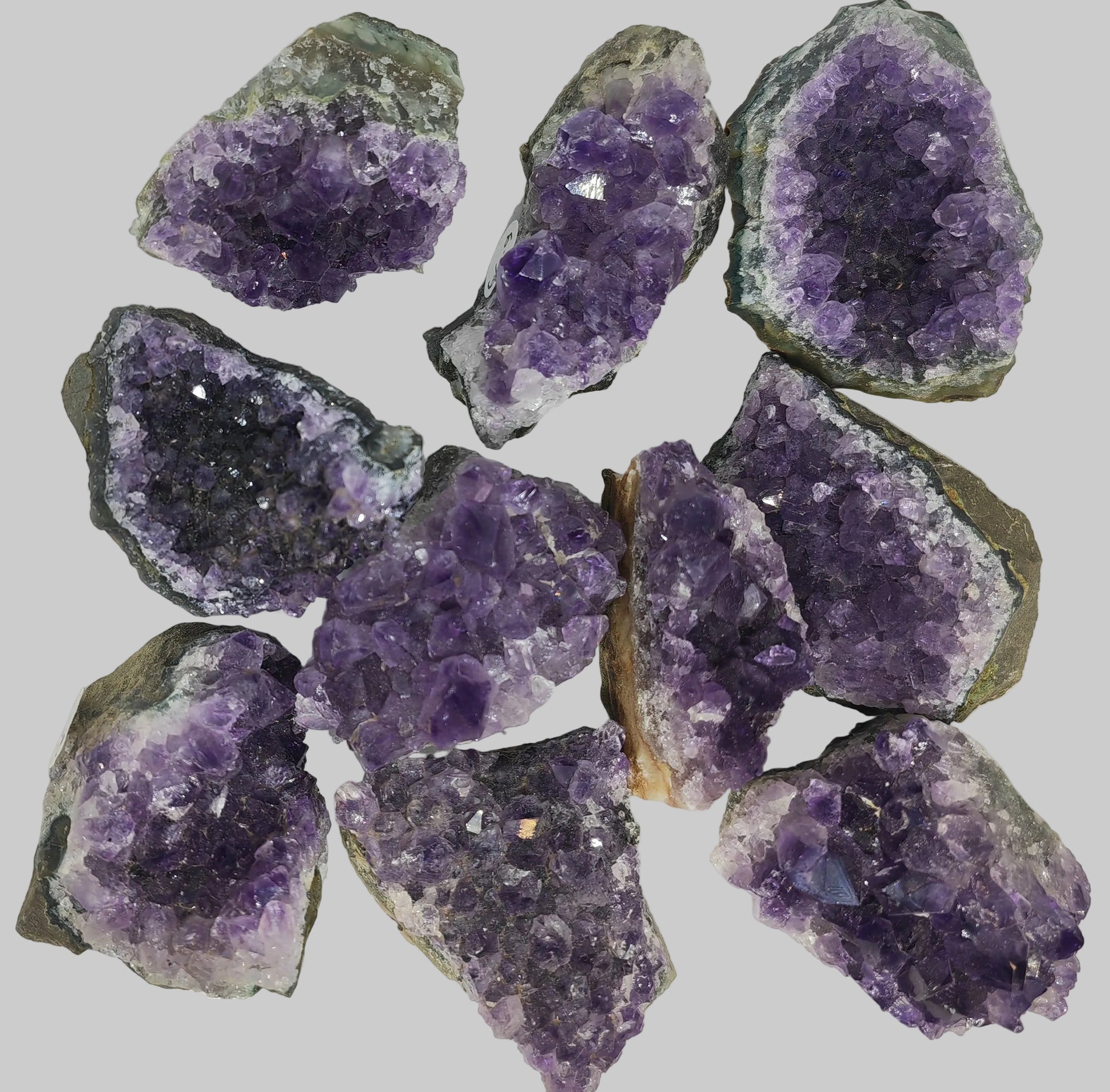 Amethyst geodes on a white background Earthstore UK