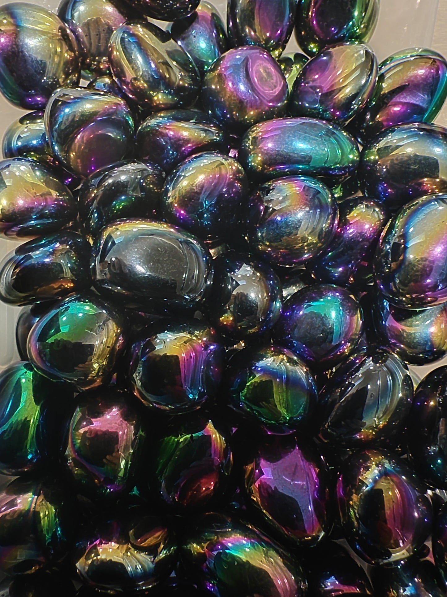 Iridescent tumblestones with multicolor reflections 