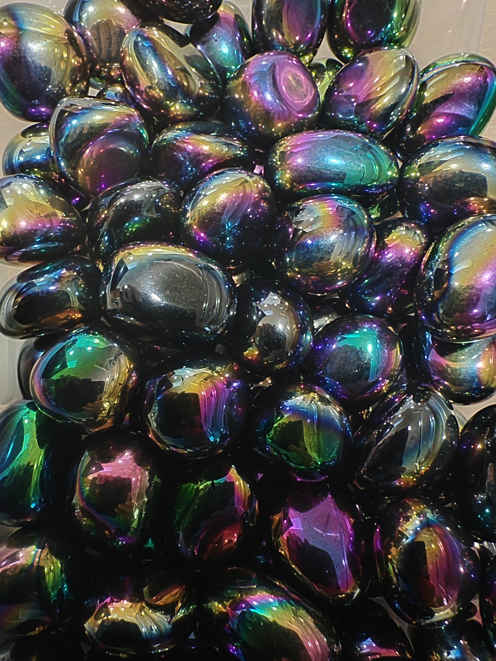Iridescent tumblestones with multicolor reflections 