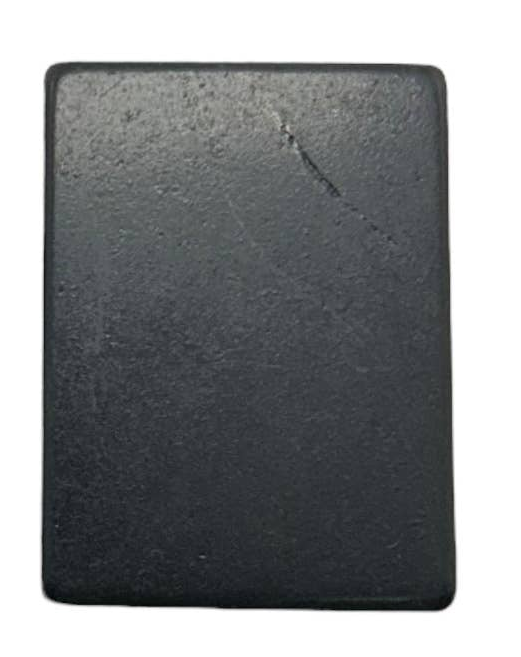 Two black shungite rectangular solid bars, likely soap or wax pucks, shown side-by-side on a plain white background.