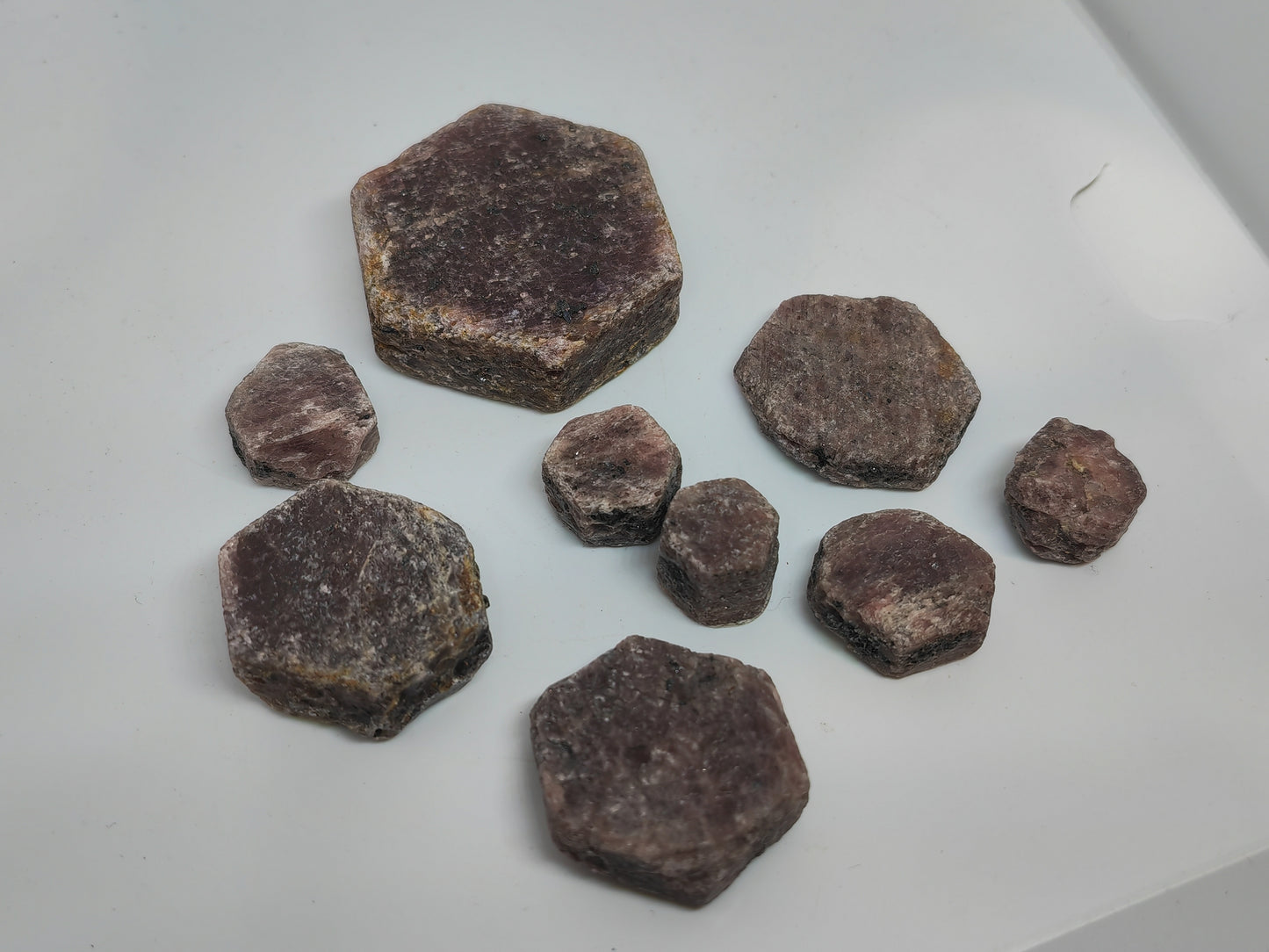 Hexagonal brown stones on a white surface