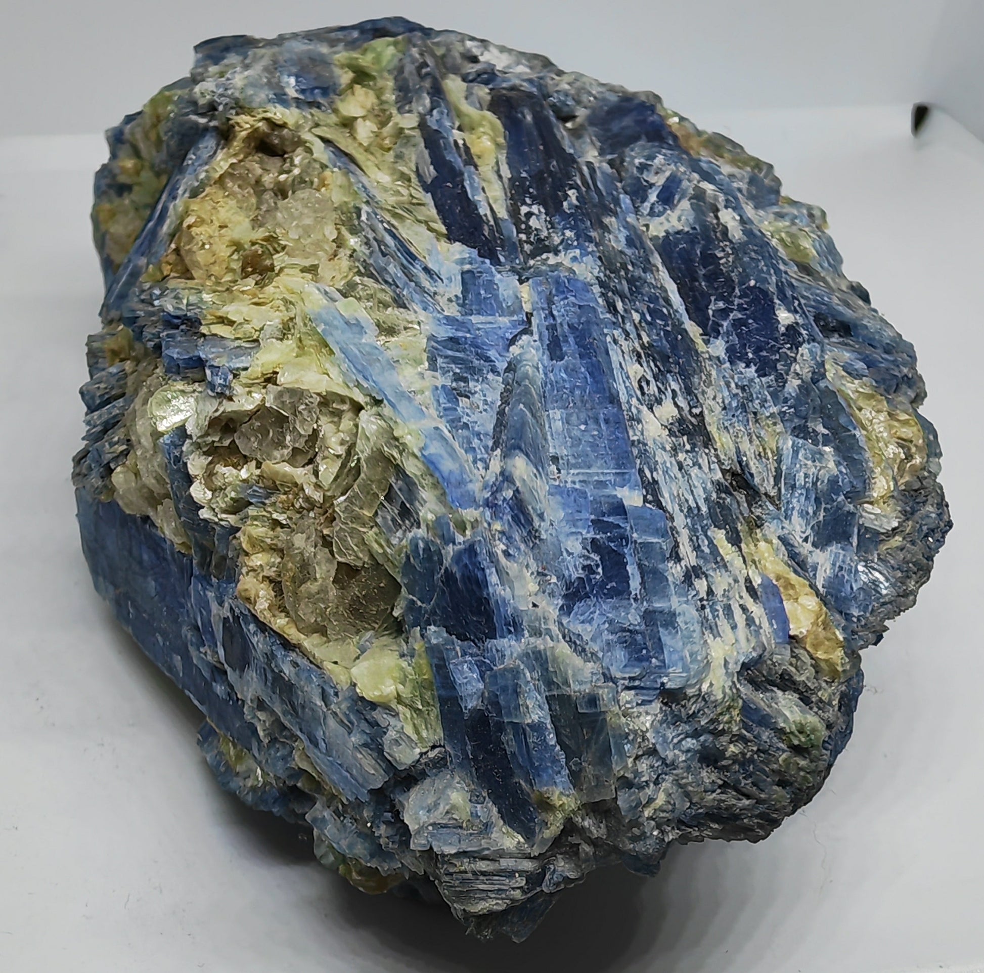 Blue and green mineral rock on a white background