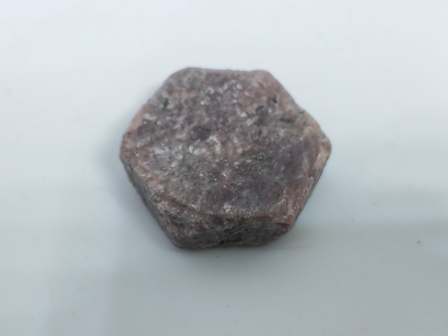 Hexagonal-shaped stone on a white background
