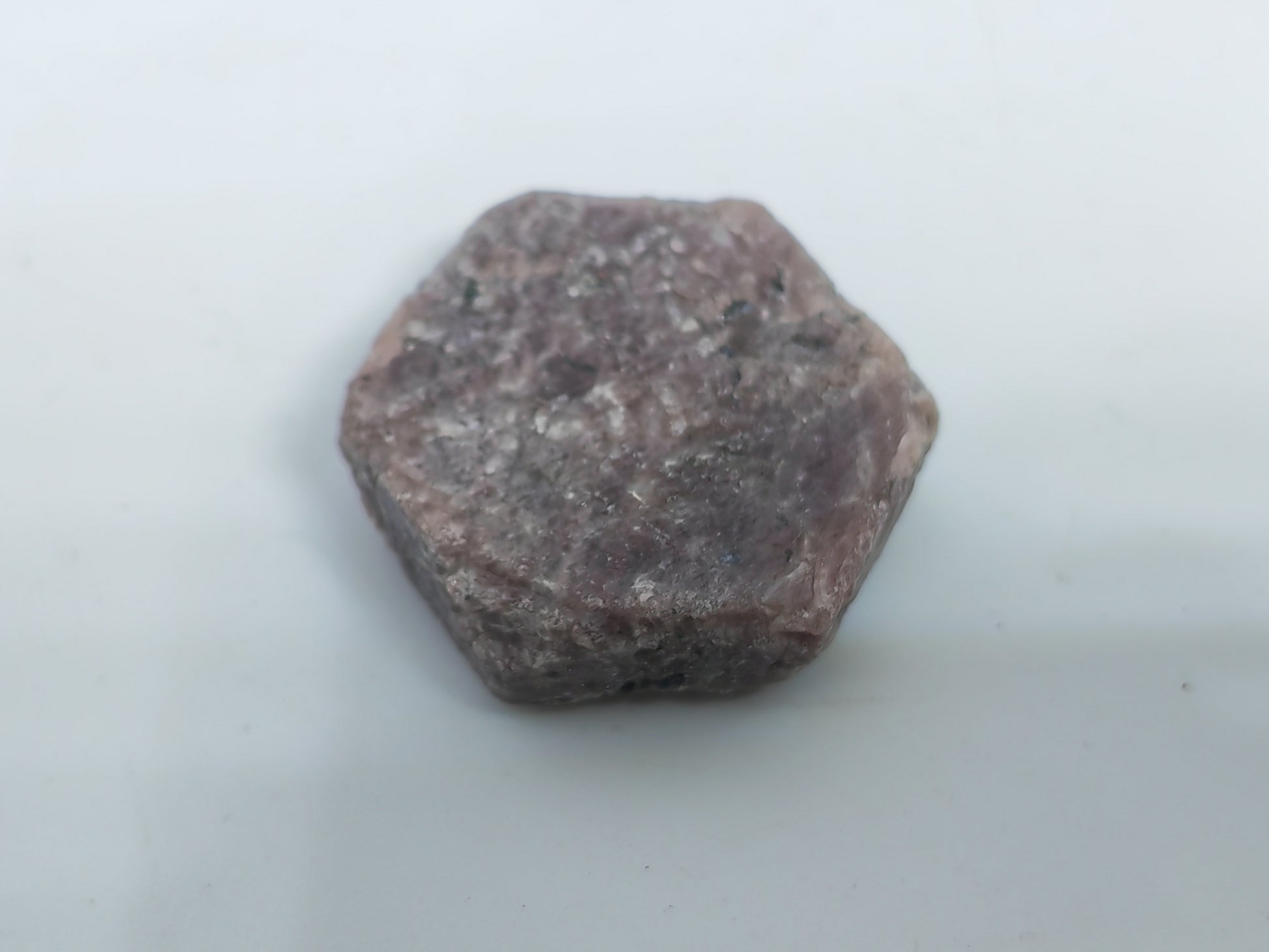 Hexagonal-shaped stone on a white background
