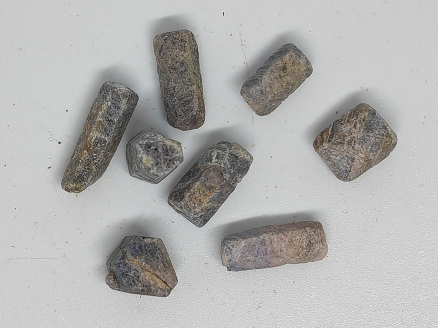 Assorted stones on a light gray background