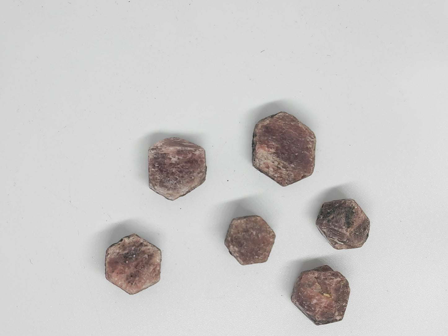 Hexagonal brown stones on a light gray background