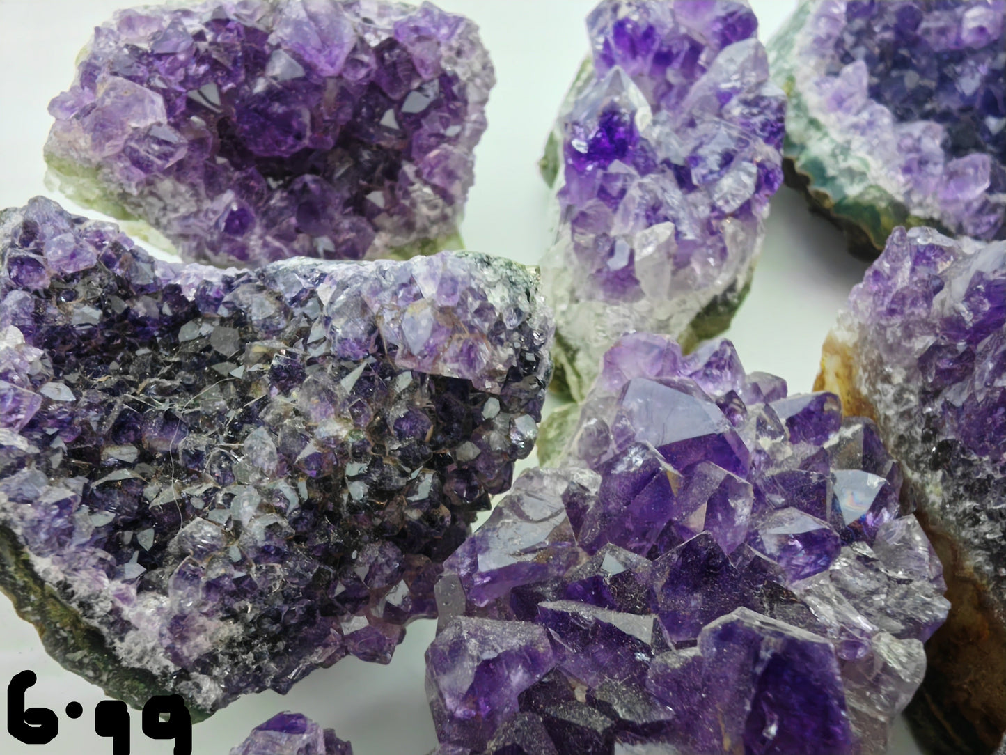 Close-up of purple crystal formations on a white background