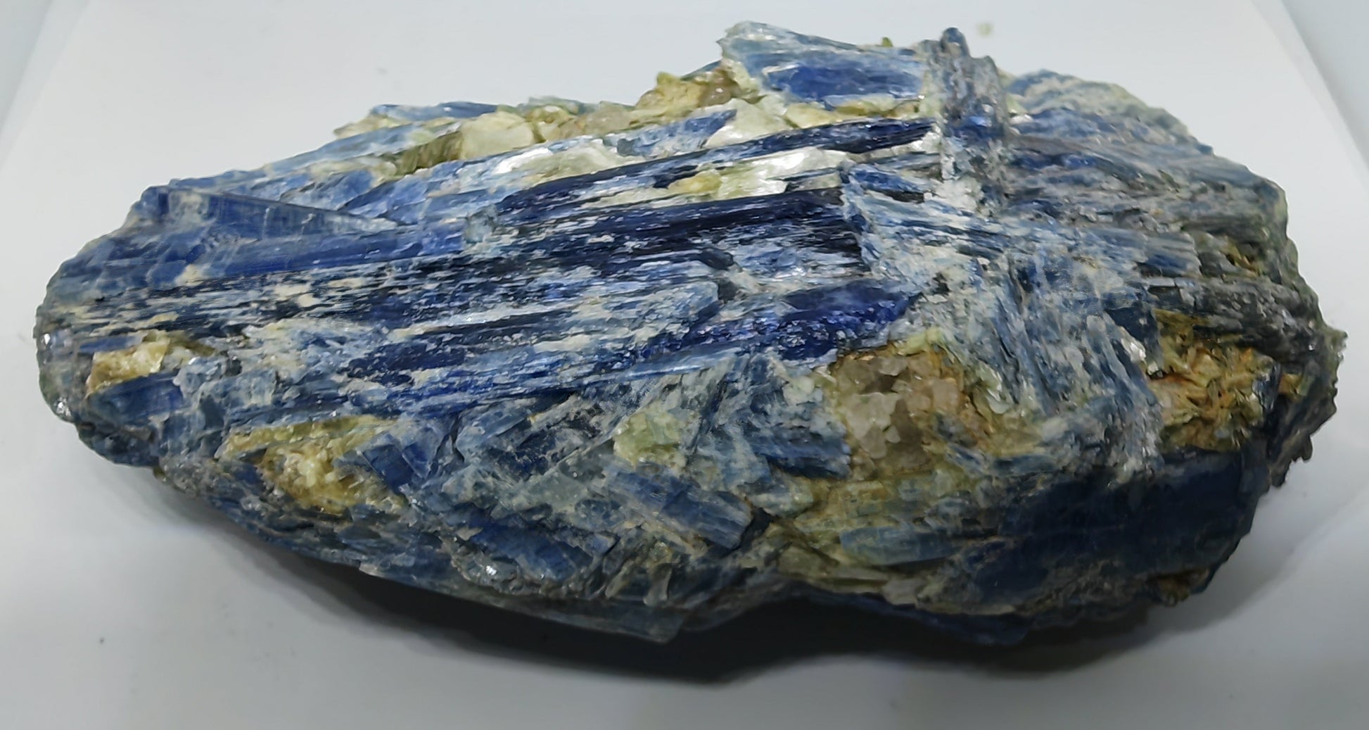 Blue and yellow mineral rock on a white background